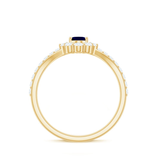 0.6 Carat Oval Cut Blue Sapphire and Diamond Chevron Ring