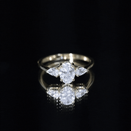 Oval and Pear Cut Moissanite Three Stone Engagement Ring