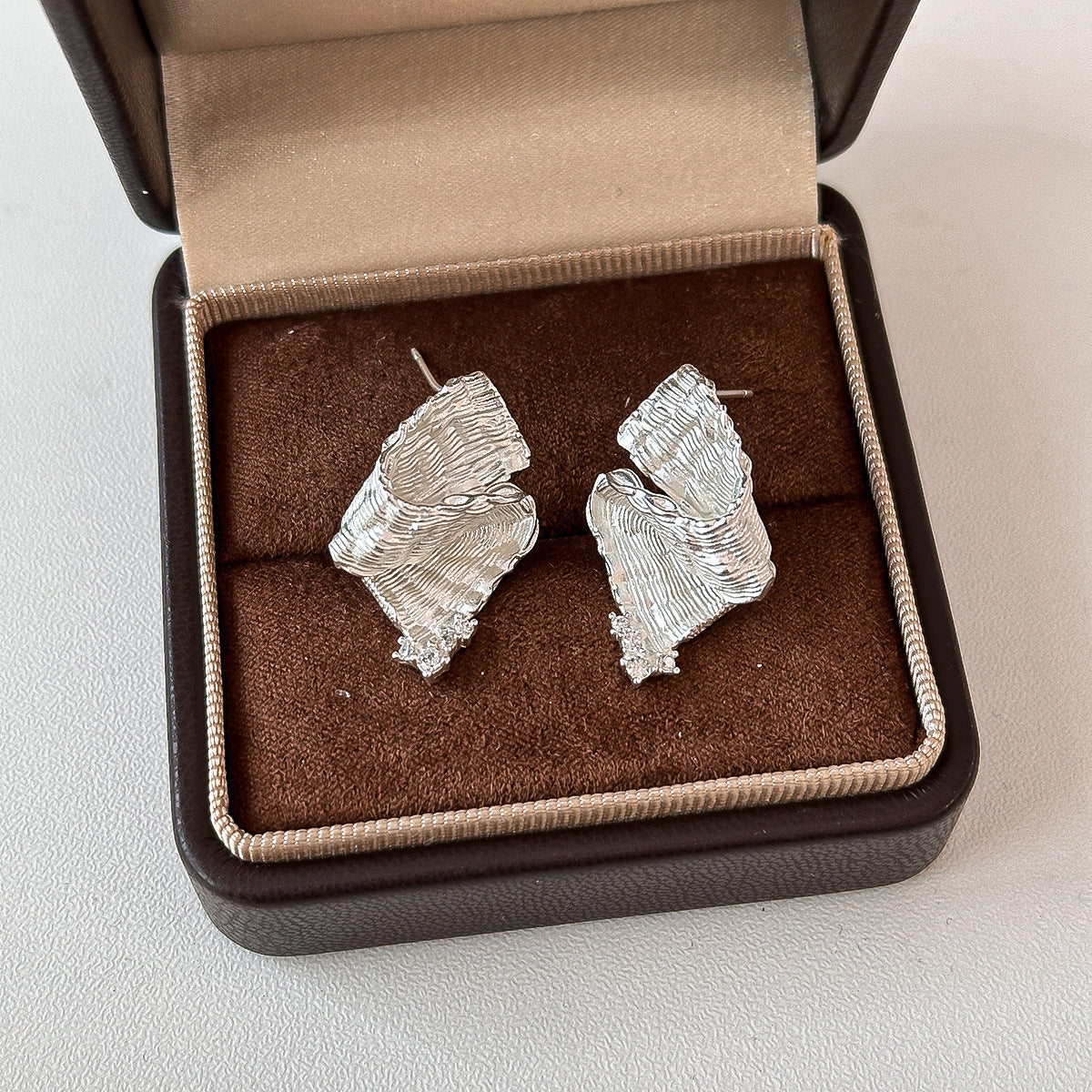 Light-luxury Plated Leaf Earrings With Irregular Diamond Inlay