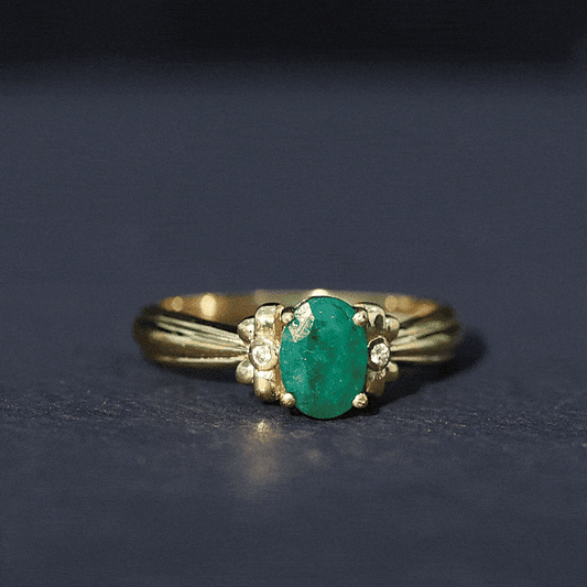 Oval Cut Emerald Solitaire Engagement Ring with Bow Design