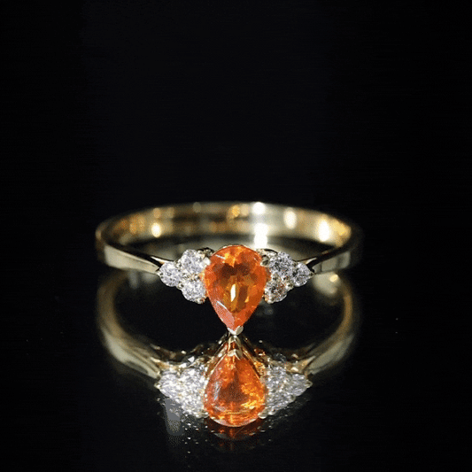0.6 Carat Pear Shaped Fire Opal Engagement Ring with Diamond Trio